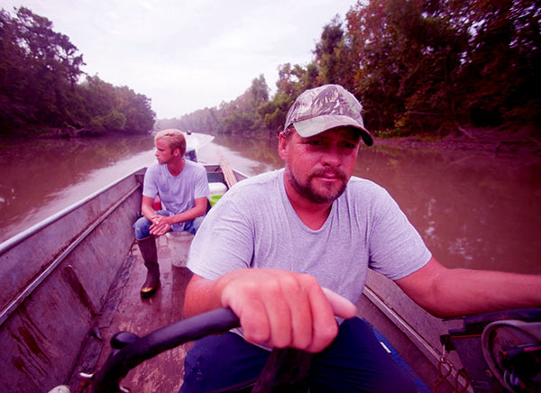 Image of Caption: Junior and his son Willie on Swamp people